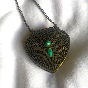 Gold locket necklace.